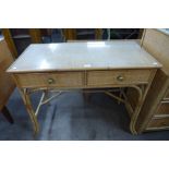 A bamboo and rattan two drawer desk