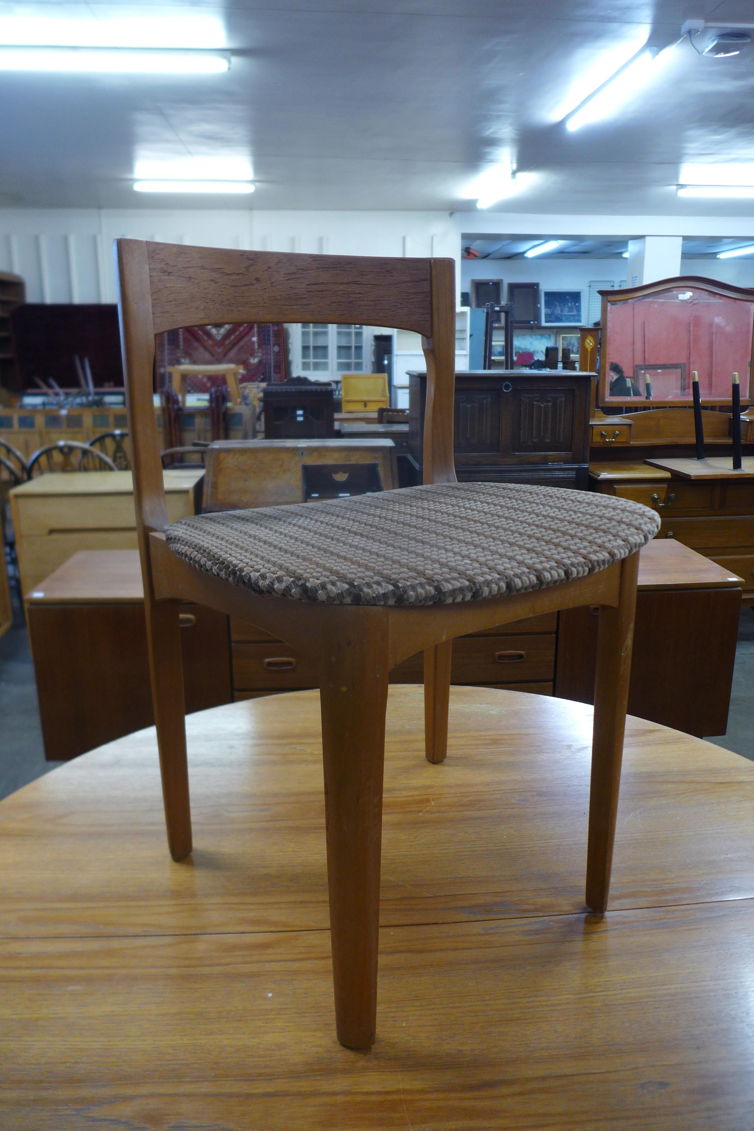 A Nathan teak circular extending dining table and three chairs - Image 2 of 2