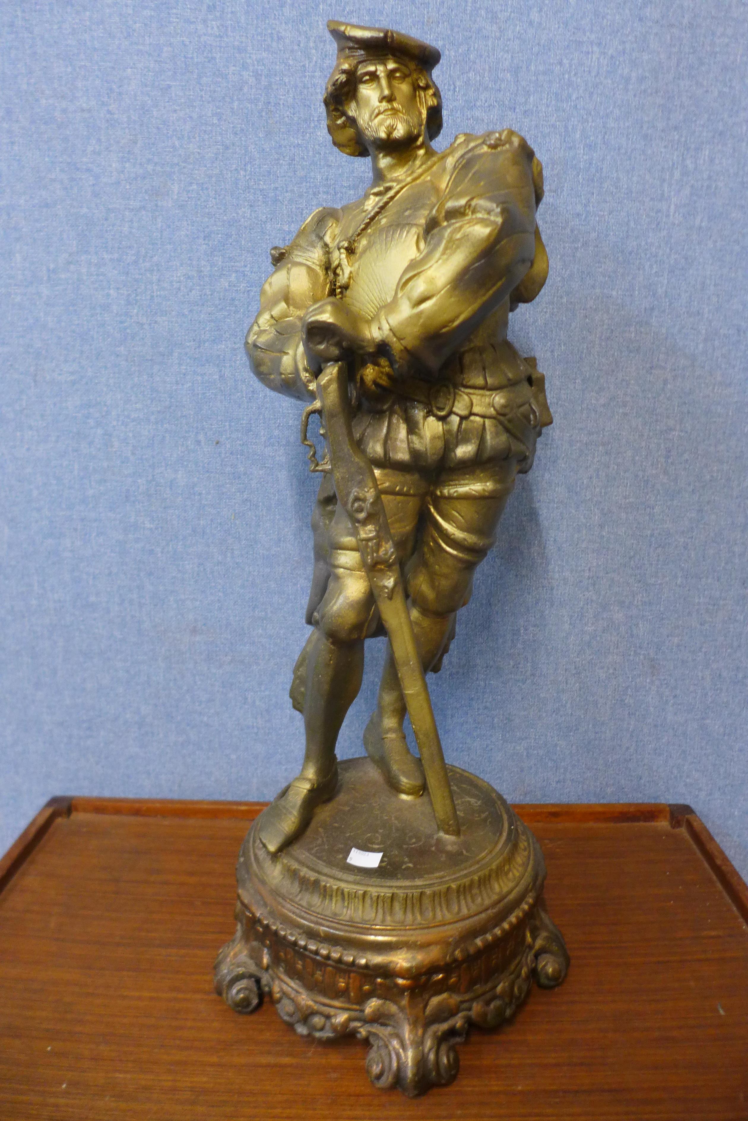 A large continental gilt spelter figure of a soldier, 74cms h