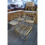 A set of three bamboo and rattan chairs and an occasional table