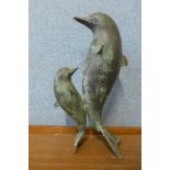 A bronze figure of Dolphins