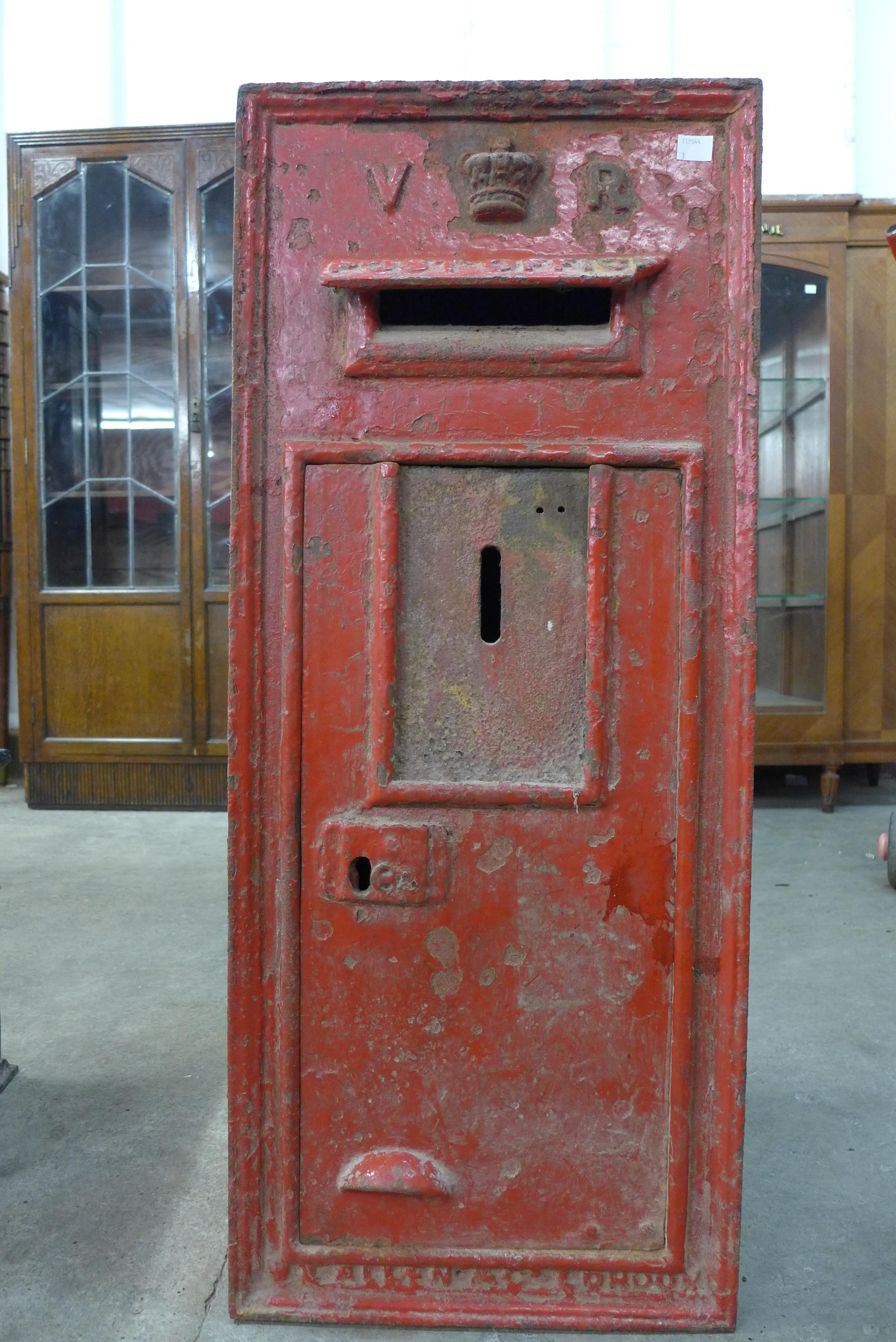 A Victorian cast iron post box