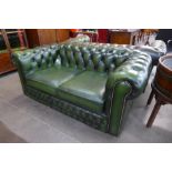 A green leather Chesterfield settee