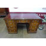 A Victorian Gothic Revival oak and red leather topped desk, manner of A.W.N. Pugin