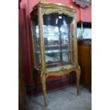 A 19th Century French rosewood and ormolu mounted serpentine vitrine, 134cms h, 74cms w, 32cms d