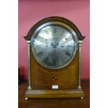 A late 19th/early 20th Century inlaid oak musical boardroom clcok, with triple chain fussee movement