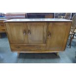 An Ercol Blonde elm and beech Windsor sideboard