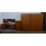 A G-Plan Fresco teak four piece bedroom suite, comprising; dressing table, chest of drawers and