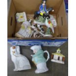 A box of Staffordshire pottery; spaniels, Dick Turpin flatback, Toby jug, a/f, candle lights, etc.