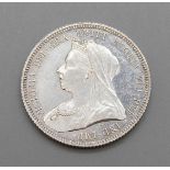An 1893 one shilling coin, uncirculated