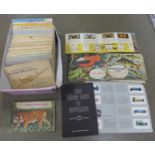 A box of cigarette card albums and tea card albums, full and partial sets