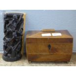 A wooden tea caddy and an African wooden sculpture