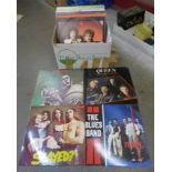 A box of 35 LP's and 12" records including Queen, Slade, ELO and Status Quo, etc.