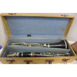 A flute, T.E. Olds & Son and a clarinet (made of different branded parts)