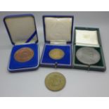 A collection of medallions; four Australia and Pope John Paul II