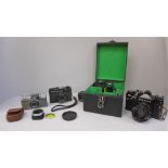A Zenit 12 x 8 film camera, lens, additional lens and flash, a Rollei XF35 camera and an Olympus-Pen