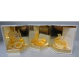 Three Lalique miniature perfumes