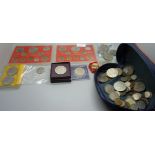 A collection of British pre-decimal coins, crowns??, a £5 coin and two badges