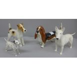 Four Beswick dogs, including a Basset hound and a Dalmatian