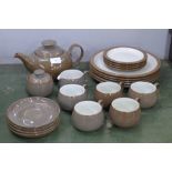 A Denby tea set including a teapot, milk jug, sugar bowl, five cups, four saucers, four side
