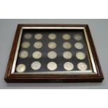 A framed set of twenty silver threepence coins