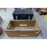 A vintage pine Schweppes advertising crate and a painted Harvey Nicholls wicker basket