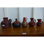 A small West German 226 model fat lava glazed pottery jug, a 108/14 Kaskade style jug and three