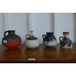 A West German N301 Jasba Keramik fat lava pottery jug and three assorted pottery jugs