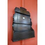 A 19th Century oak wall hanging pipe rack