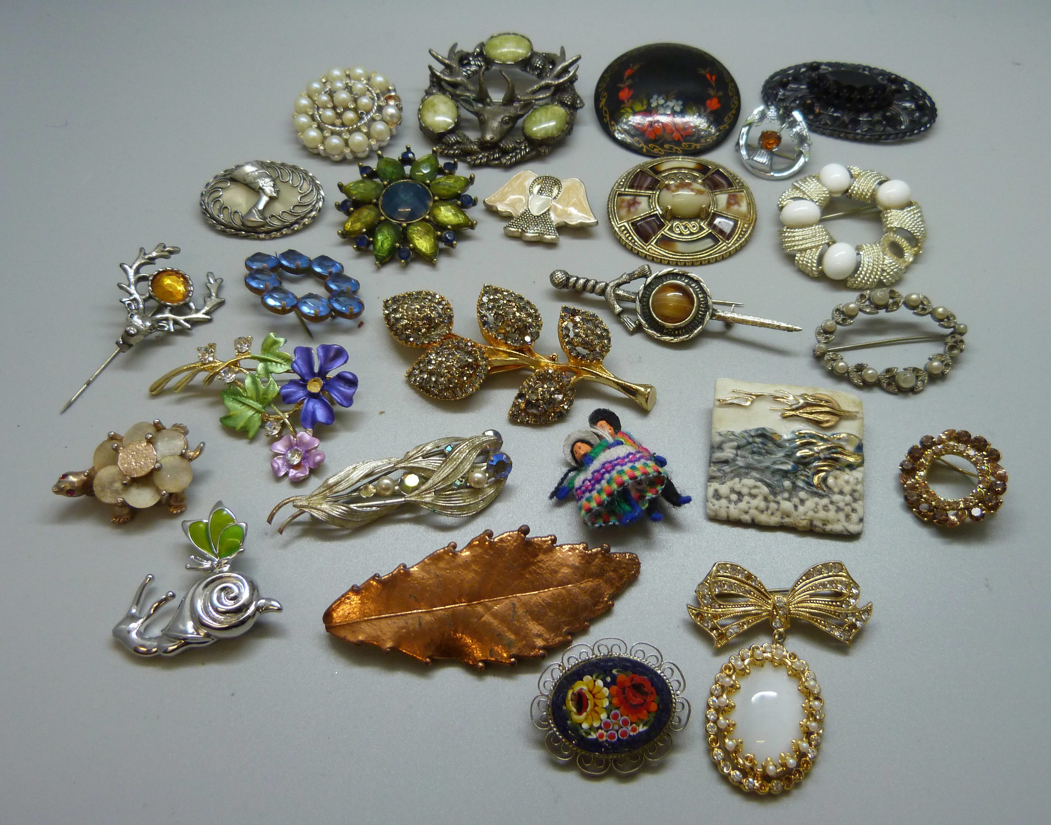 Twenty-five costume brooches