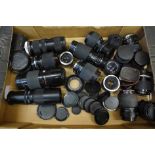 A box of 21 mixed camera lenses