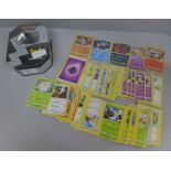 Pokemon cards; a Pokemon collectors tin containing 150 basic Pokemon cards and five holographic