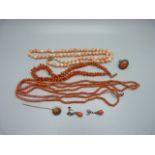 Three coral necklaces, a coral stick pin, ring and pair of earrings