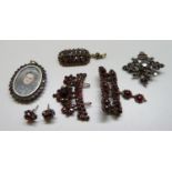 A collection of Victorian garnet jewellery, one with oval watercolour portrait of a lady, some