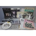 A collection of Beatles ephemera including a souvenir Beatles plate and songbook