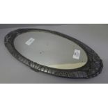 A mirror centrepiece base, circa 1920 in soft metal stamped 'made in France' Depose 84, 43cm x 20cm