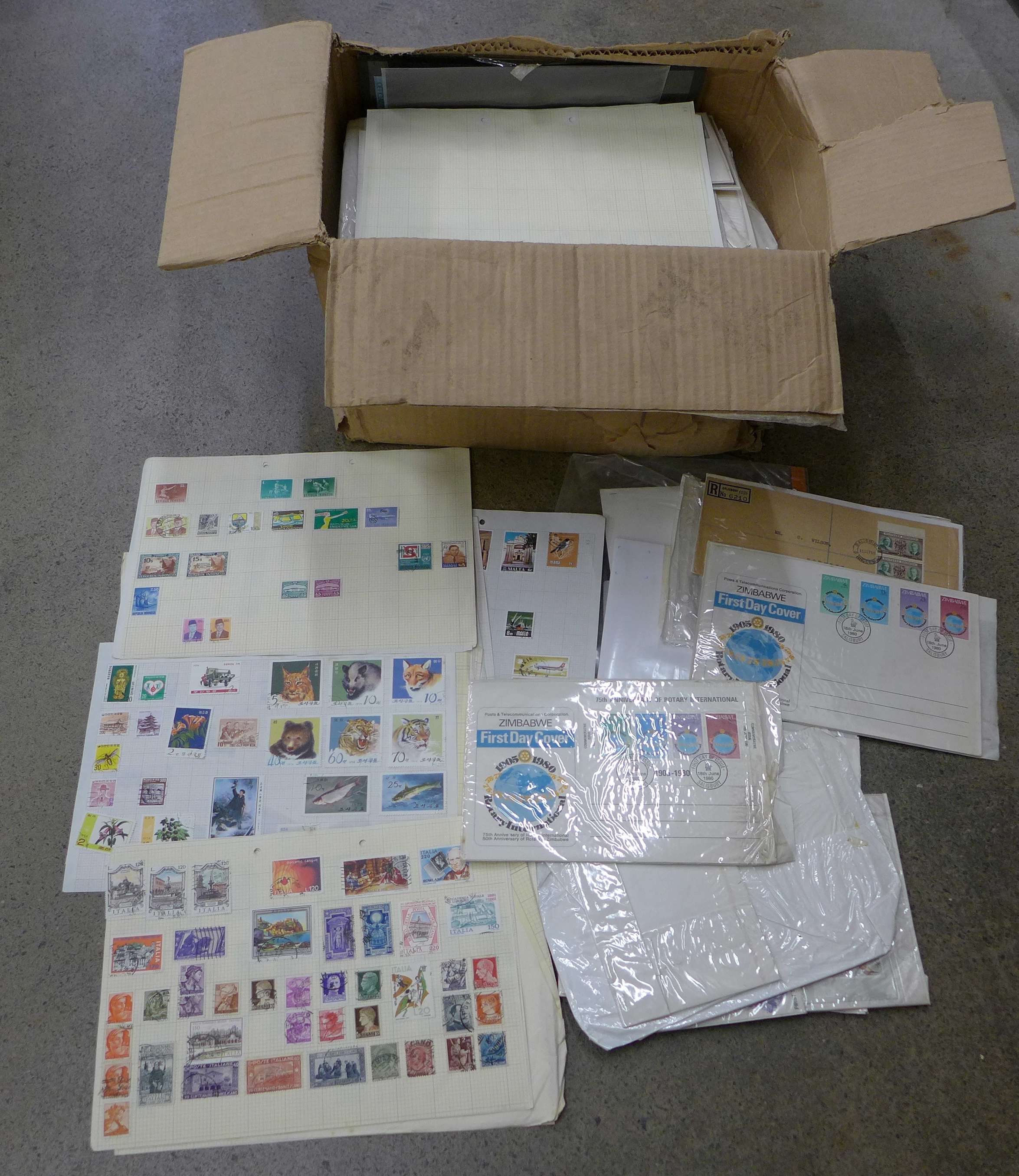 A quantity of stamps, some loose and on stock cards and first day covers