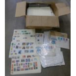 A quantity of stamps, some loose and on stock cards and first day covers