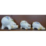 Three graduated ceramic piggy banks