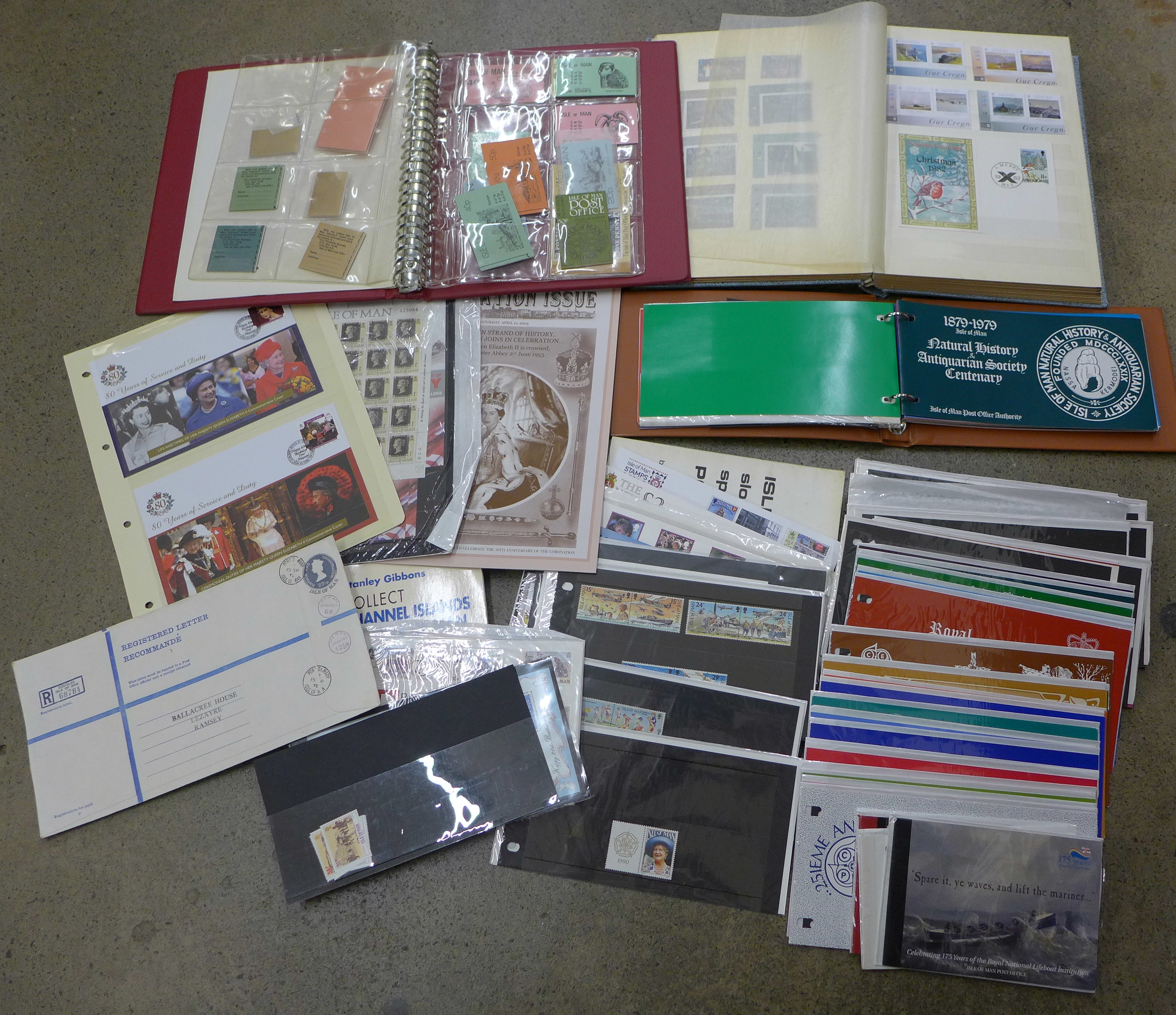 Stamps; a collection of Isle of Man in box with stock book of mint, album of booklets, album of