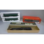 A Tri-ang Wrenn 00 gauge 8F 2-8-0 locomotive and tender and a R.157 diesel railcar power and