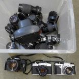 Six vintage SLR cameras and eight lenses