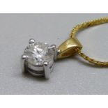 An 18ct gold and diamond pendant, approximately 0.90ct diamond weight, on a plated chain