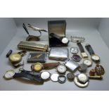 Mixed wristwatches, a jet aircraft pen holder, a Hohner harmonica, etc.