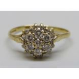 An 18ct gold and twenty-four stone diamond ring, 2.6g, S