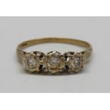 A 9ct gold and three stone ring, 1.6g, N (one stone tests diamond)