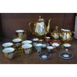 A Czechoslovakian gold lustre tea set and a set of six Past Times cups and saucers