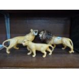 A Beswick lion, lioness and cub ceramic figures