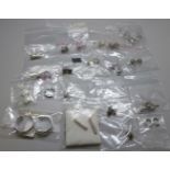 A collection of twenty pairs of silver earrings