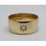 A 9ct gold ring set with a diamond, W, 6.7g